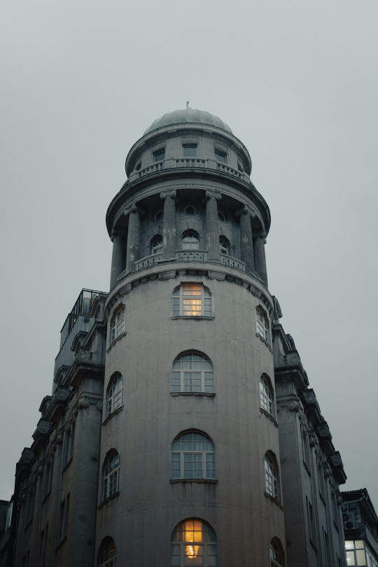 A tall building with a clock on the top of it