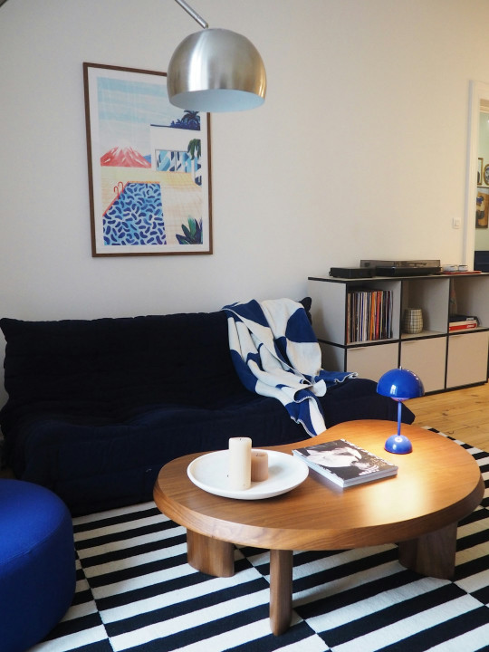 A living room with a black and white checkered floor