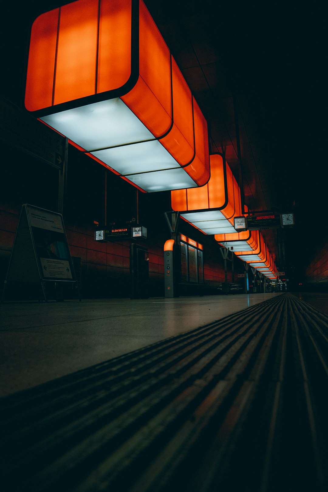 A train station with a train on the tracks