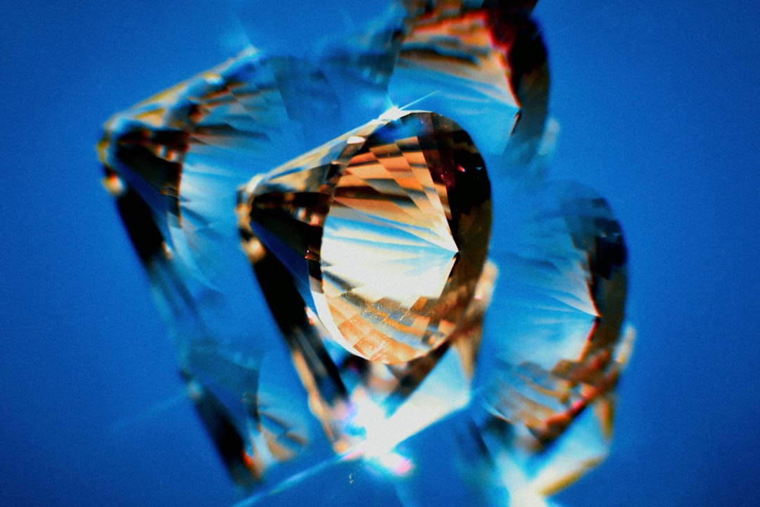 A close up of a diamond on a blue background