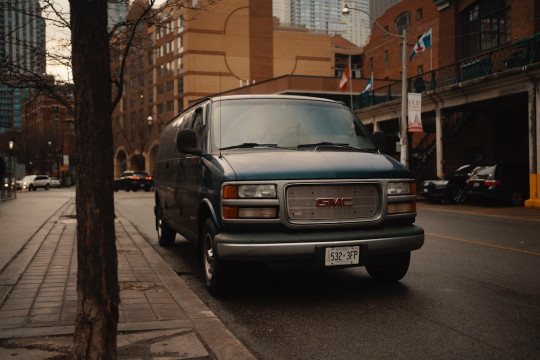 A van is parked on the side of the road