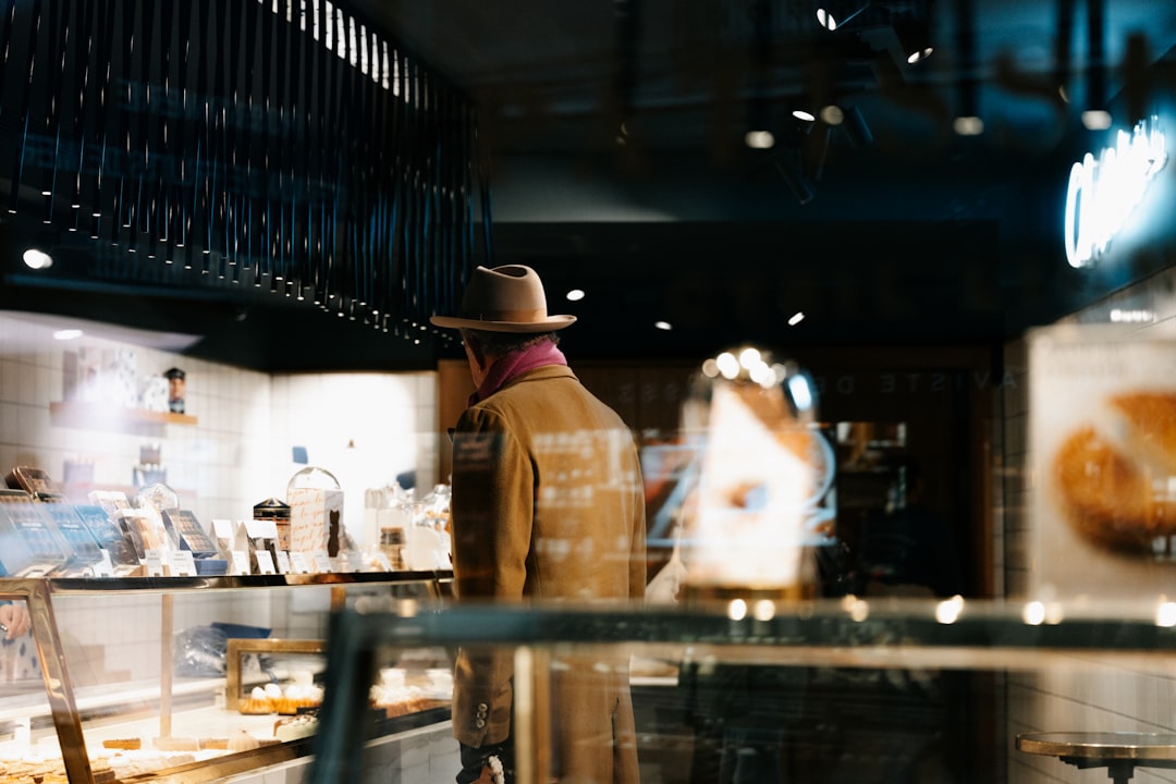 A man standing in front of a counter in a store