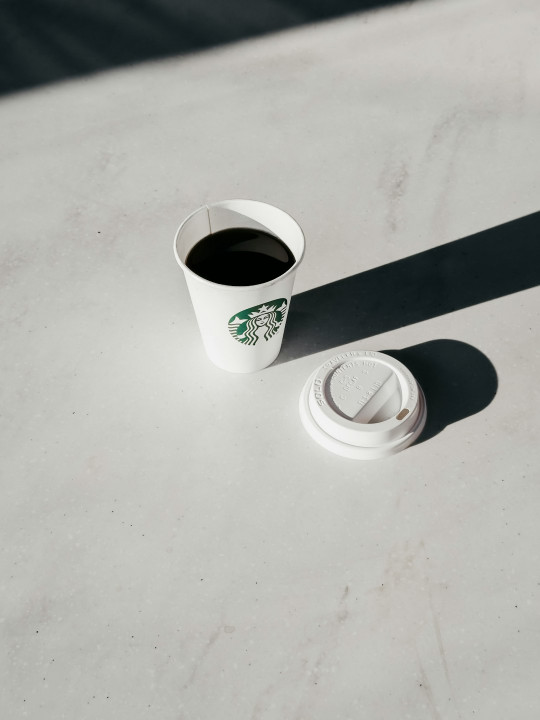 A cup of coffee sitting on top of a table