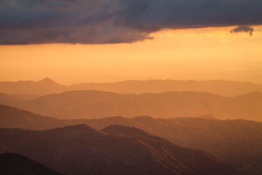 A view of a mountain range at sunset