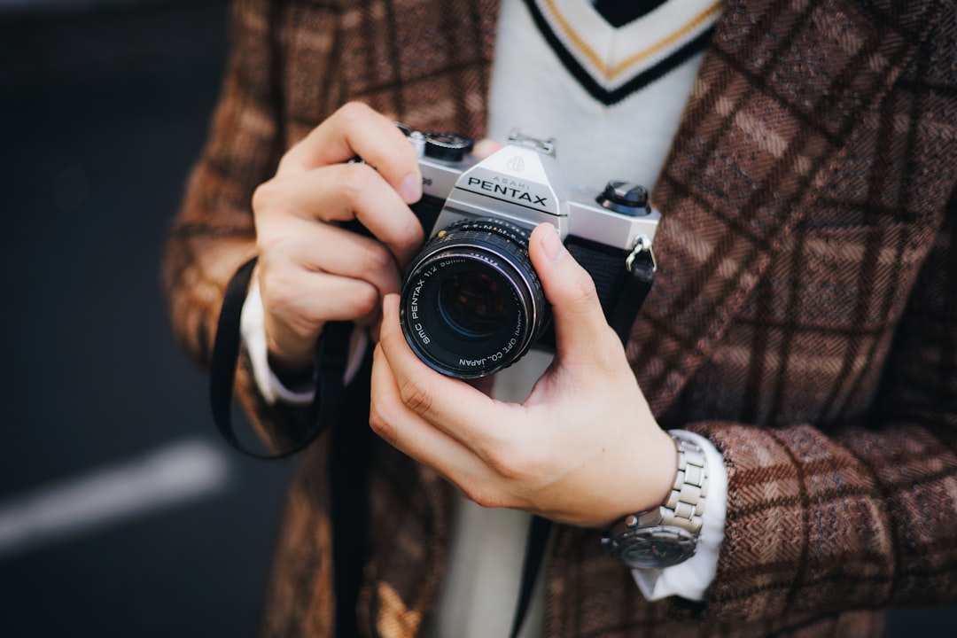 A person holding a camera taking a picture