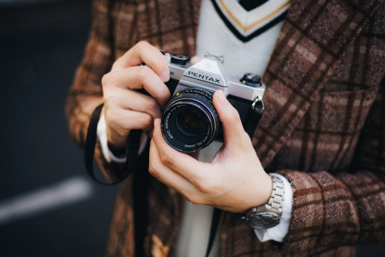 A person holding a camera taking a picture