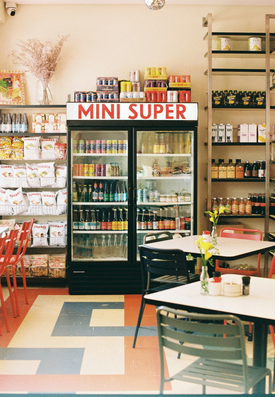 A store filled with lots of bottles and tables