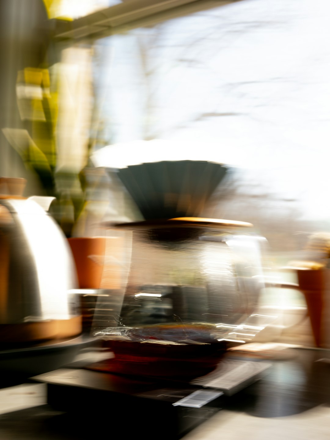 A blurry photo of pots and pans on a counter