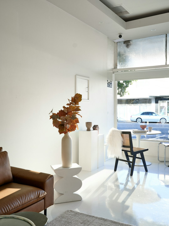 A living room filled with furniture and a large window