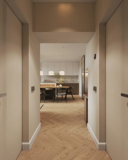 A hallway leading to a kitchen and dining room