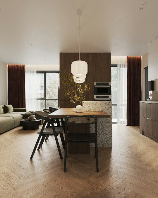 A modern kitchen and living room are shown