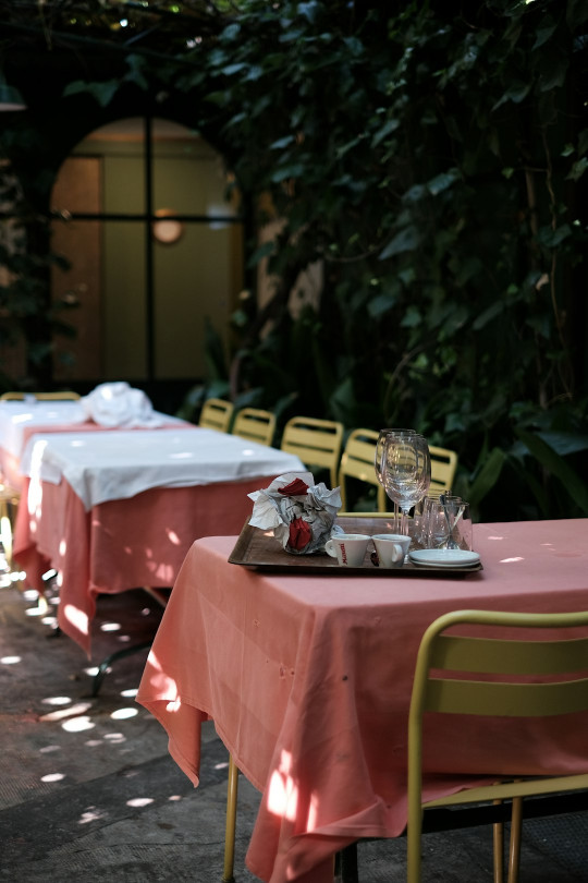 A table set up for a meal in a garden