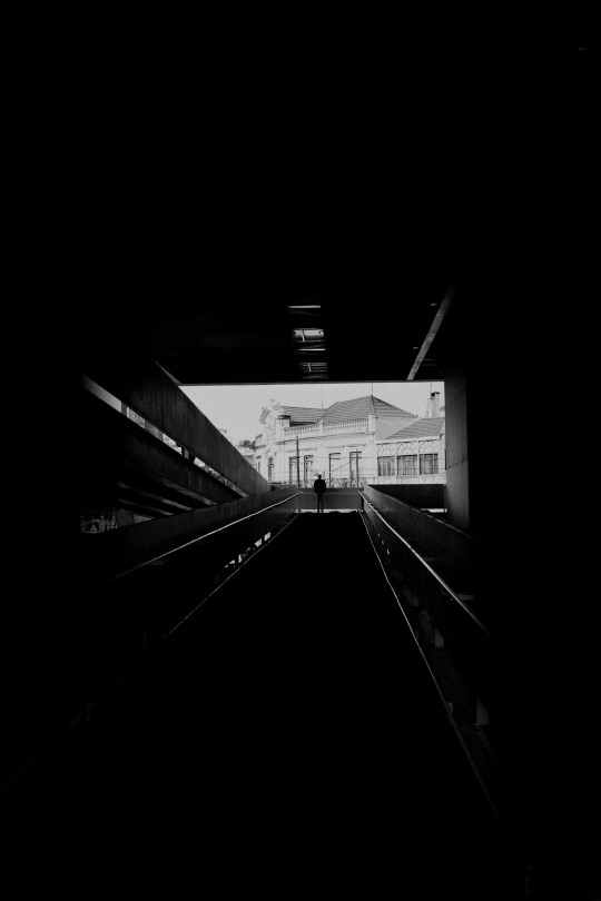 A black and white photo of a train track