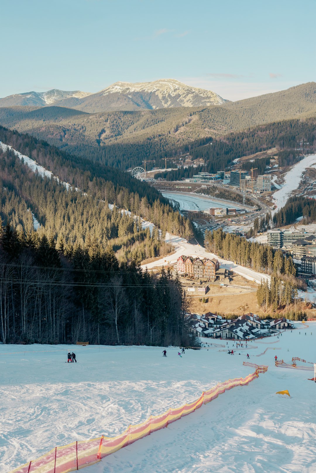 A view of a ski resort from the top of a hill