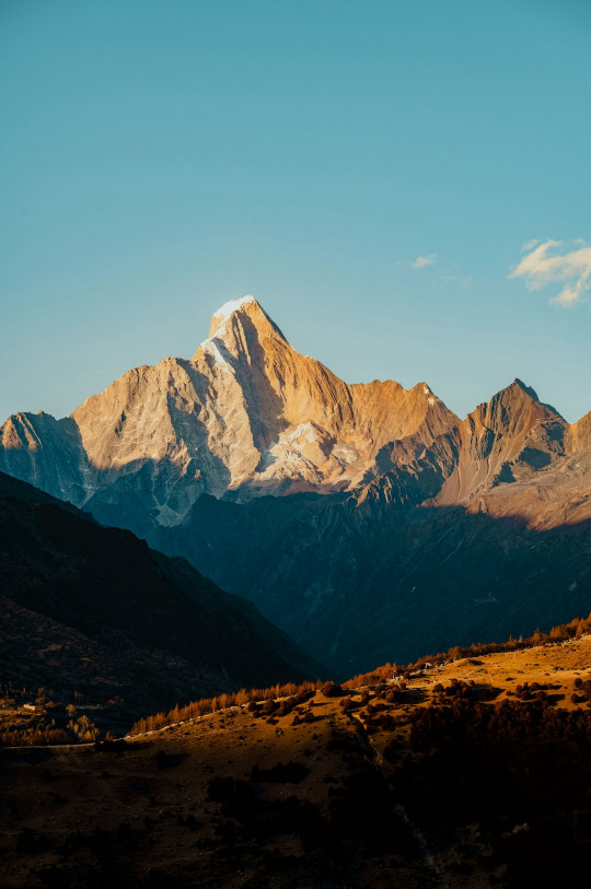 A view of a mountain range from a distance