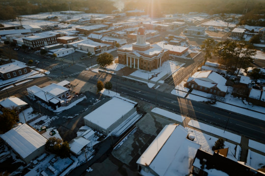 An aerial view of a snow covered city