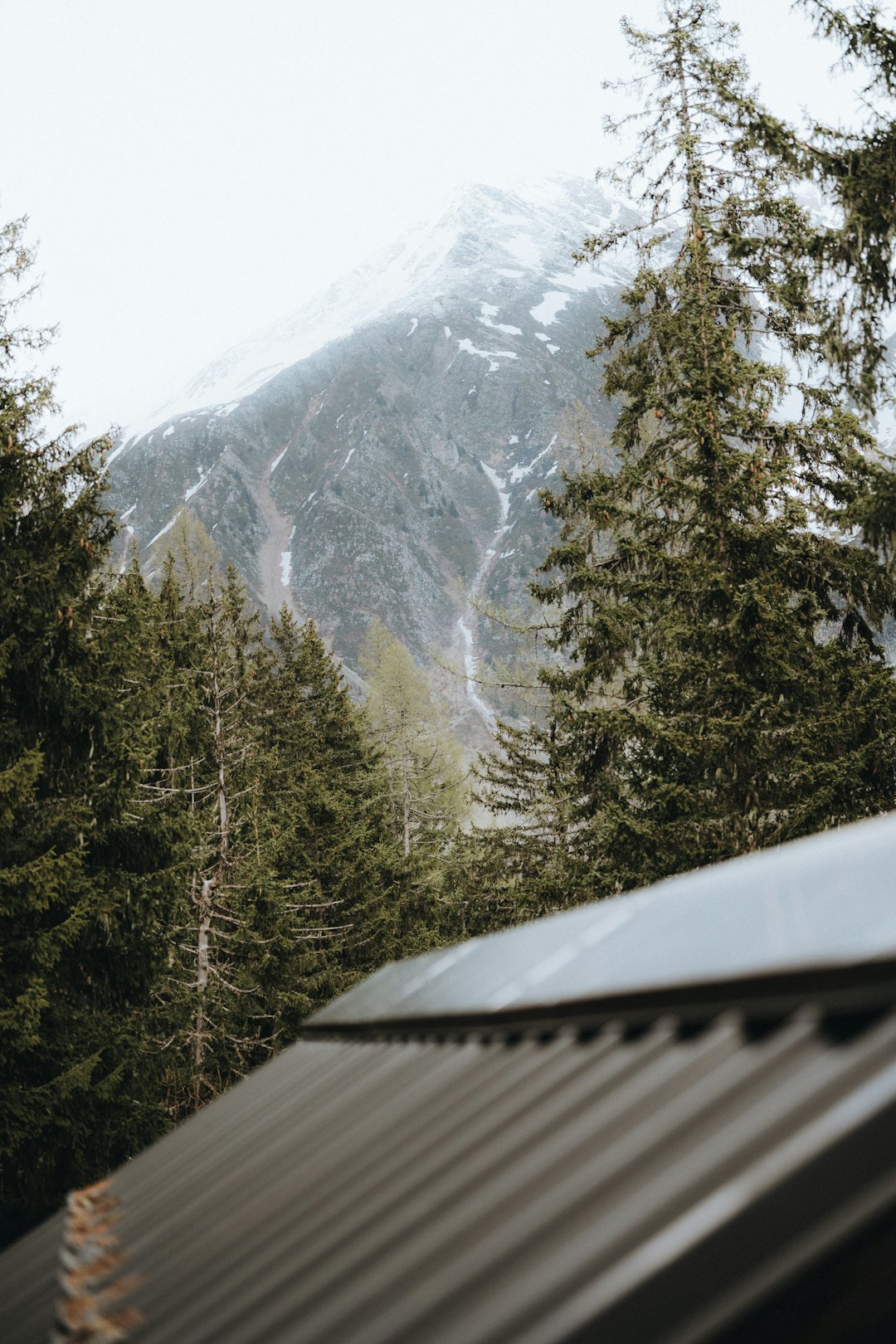 A view of a mountain from a roof of a house