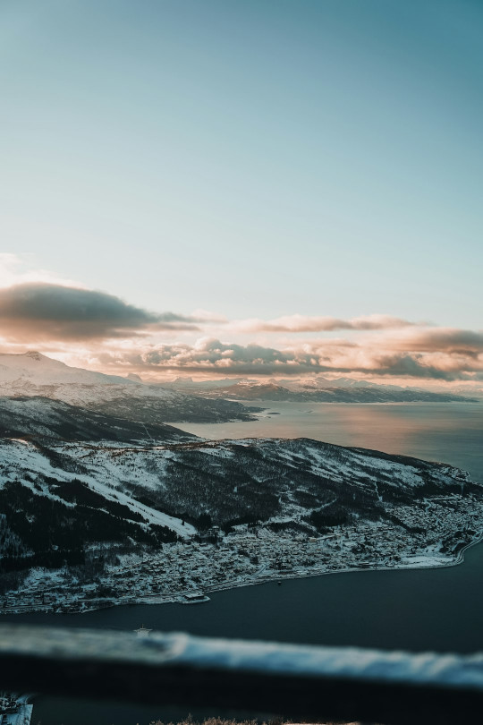 A view of a lake and mountains from a plane