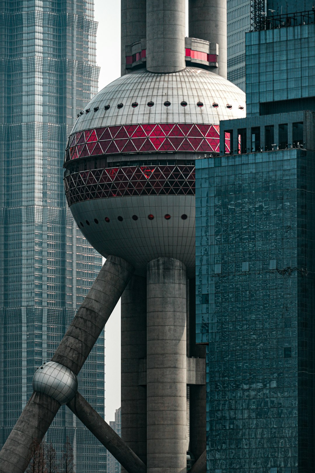 A very tall building with a red and white top