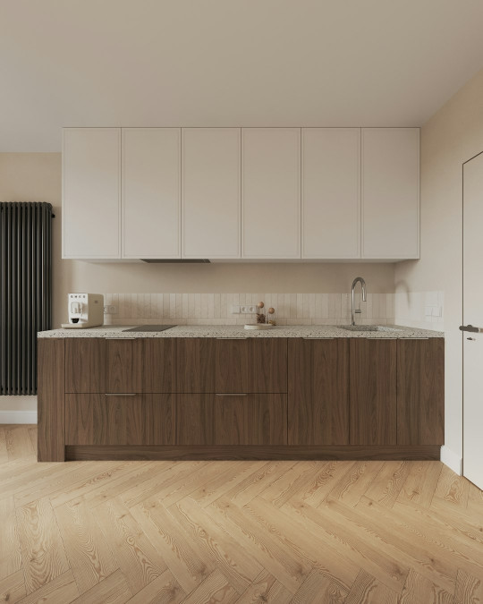 A large kitchen with a wooden floor and white cabinets