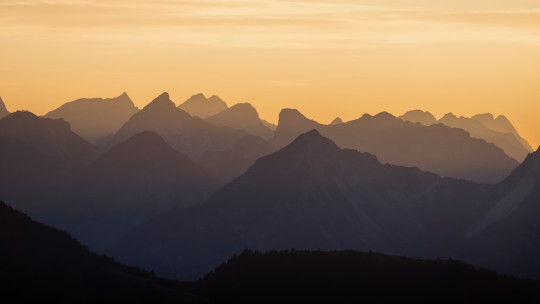 A view of a mountain range at sunset