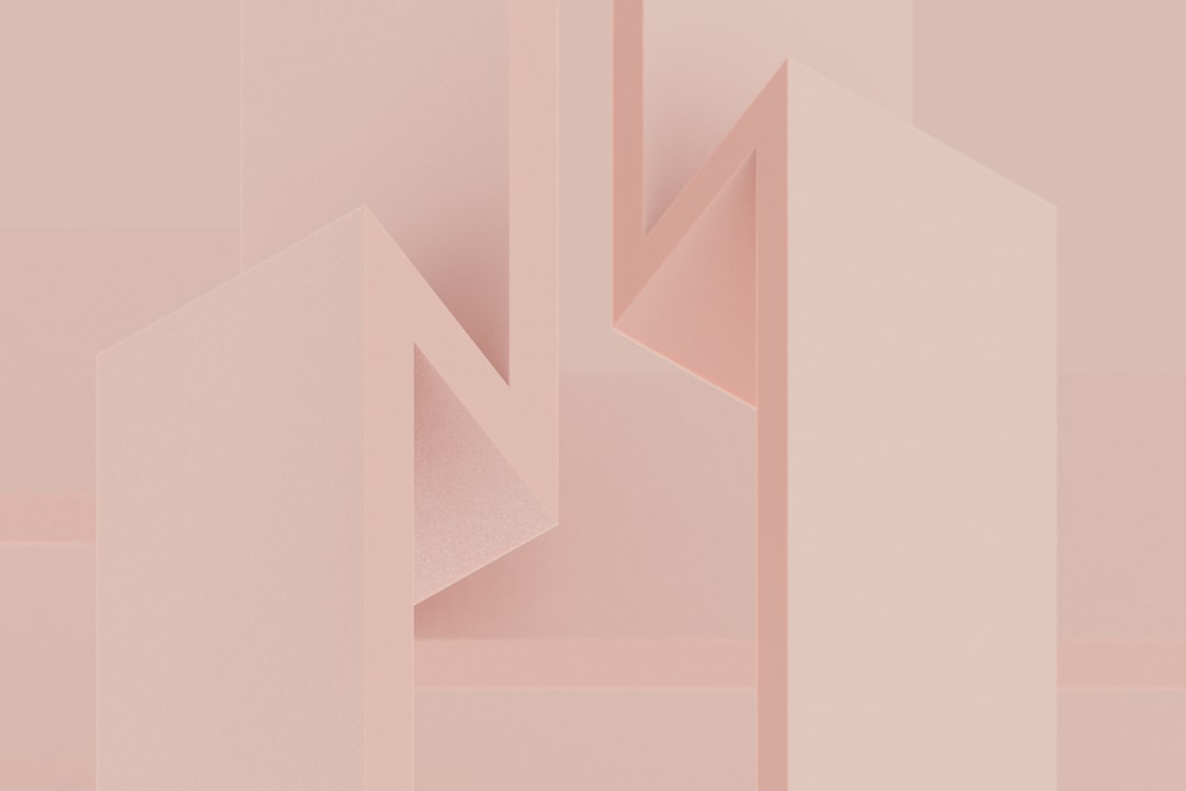 A pink abstract background with geometric shapes