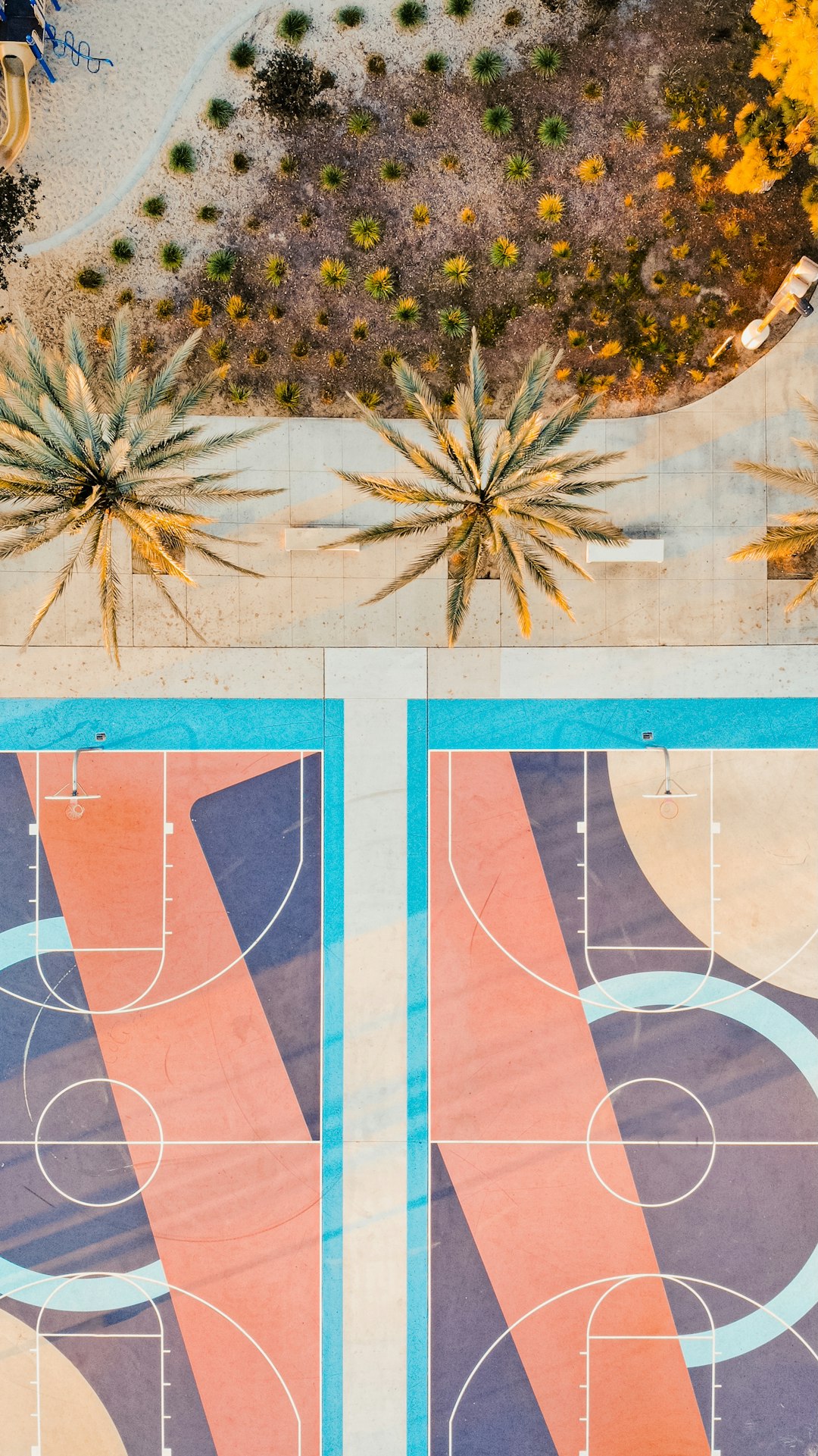 An aerial view of a basketball court in a park