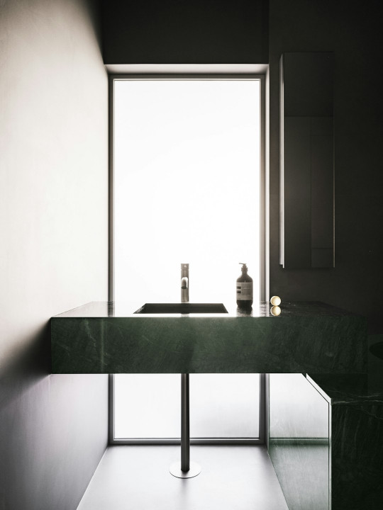 A black and white photo of a bathroom sink