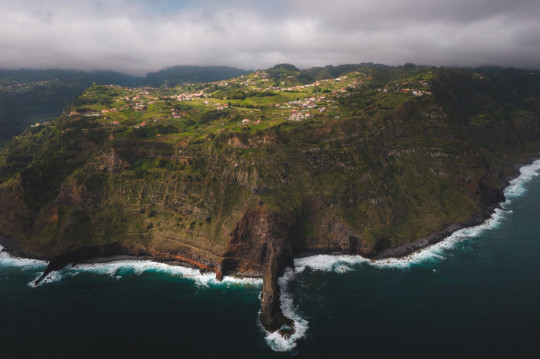 An aerial view of an island in the middle of the ocean