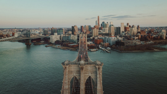 An aerial view of a city and a bridge