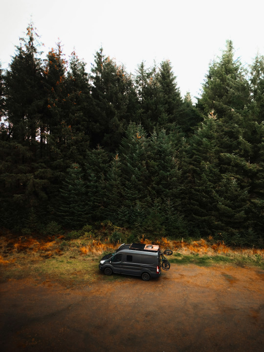 A car that is sitting in the dirt