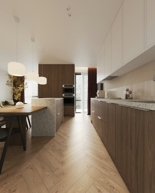 A large kitchen with a wooden floor and a dining table