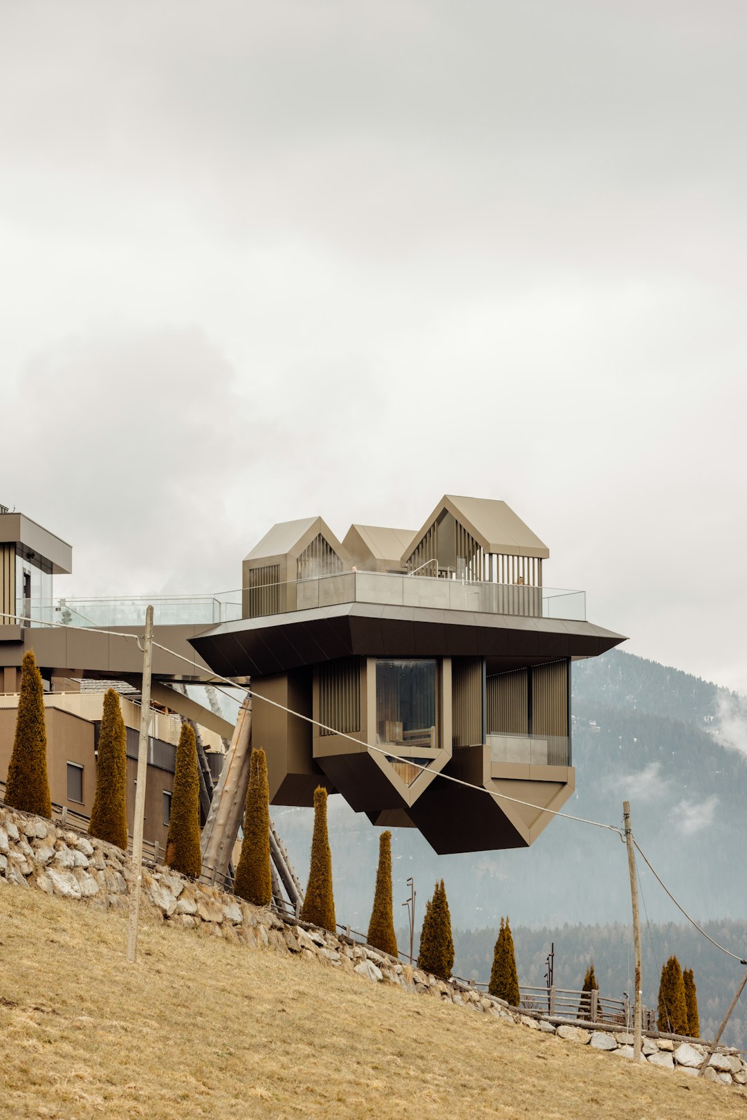 A couple of houses sitting on top of a hill