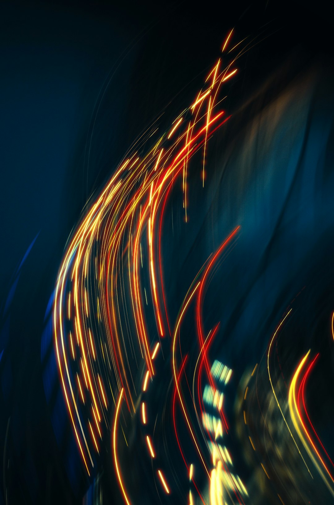 Light trails create an abstract, dynamic night scene.