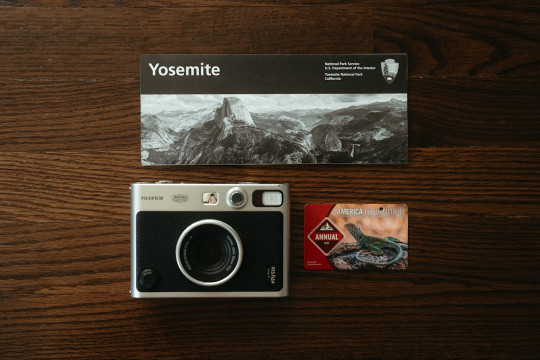 A camera sitting on top of a wooden table