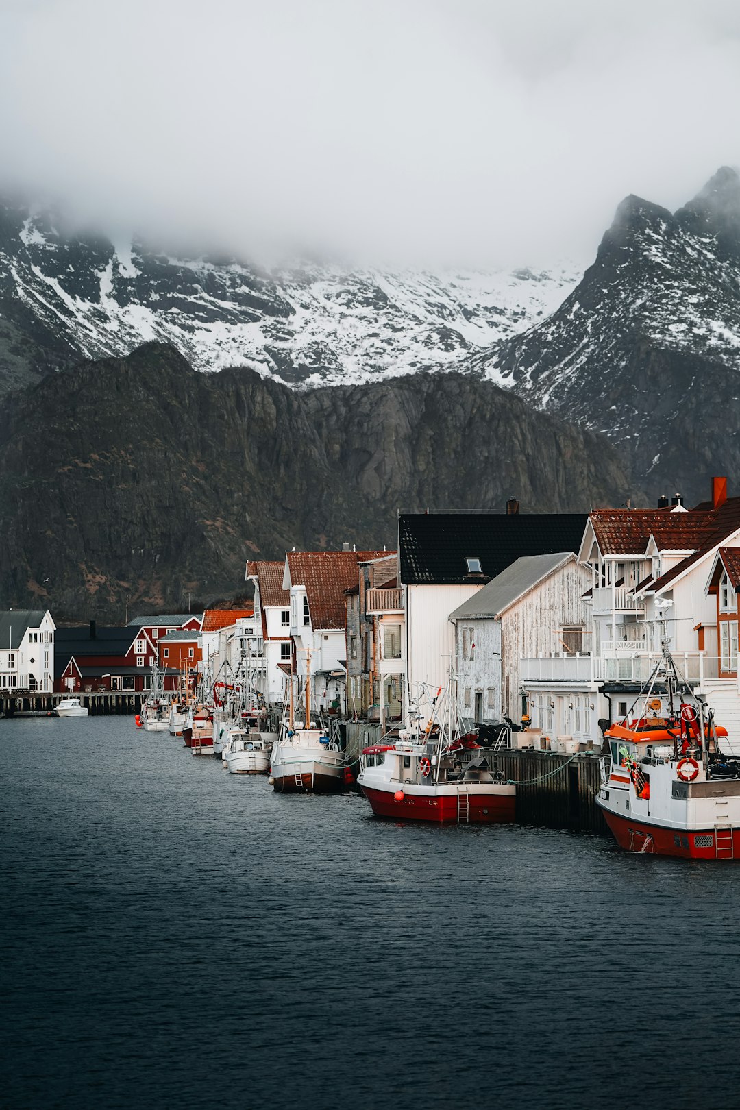 A group of boats that are sitting in the water