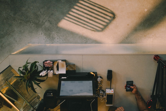 A counter with equipment and strong shadows.