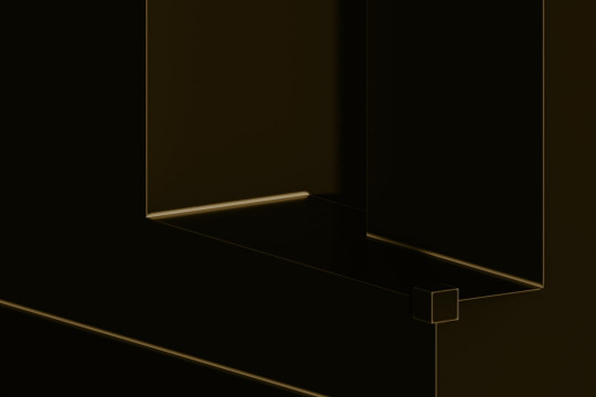 A corner of a black wall with a light shining on it