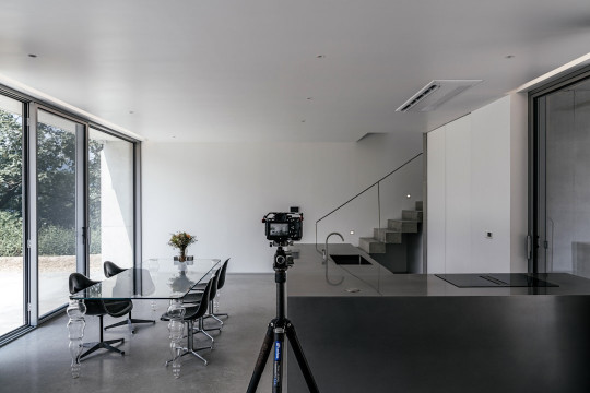 A camera set up in front of a dining room table