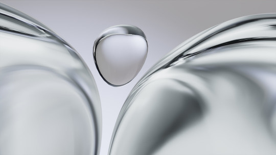 A close up of a metal object with a drop of water