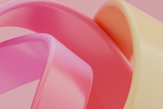 A close up of a pink and yellow object