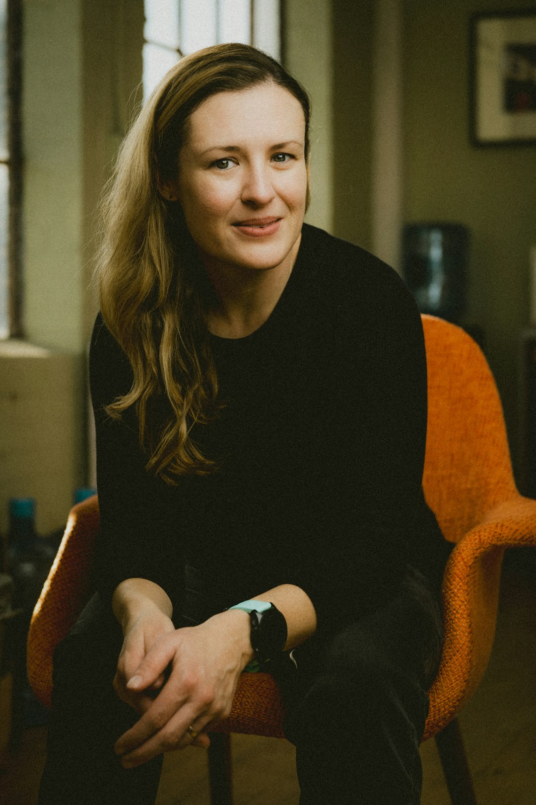 A woman sitting in a chair in a room