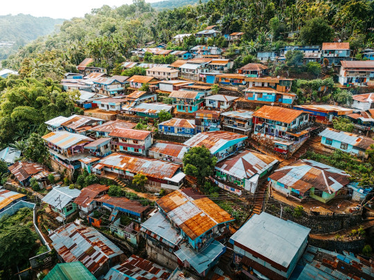 An aerial view of a village in the mountains