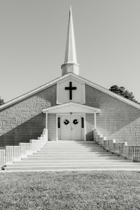 A black and white photo of a church