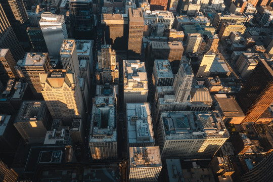 An aerial view of a city with tall buildings