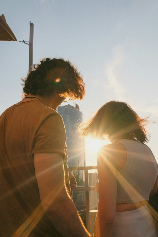 a man and a woman standing next to each other