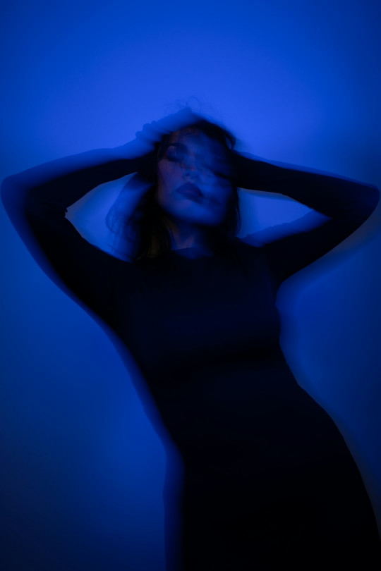 A woman with her hands on her head