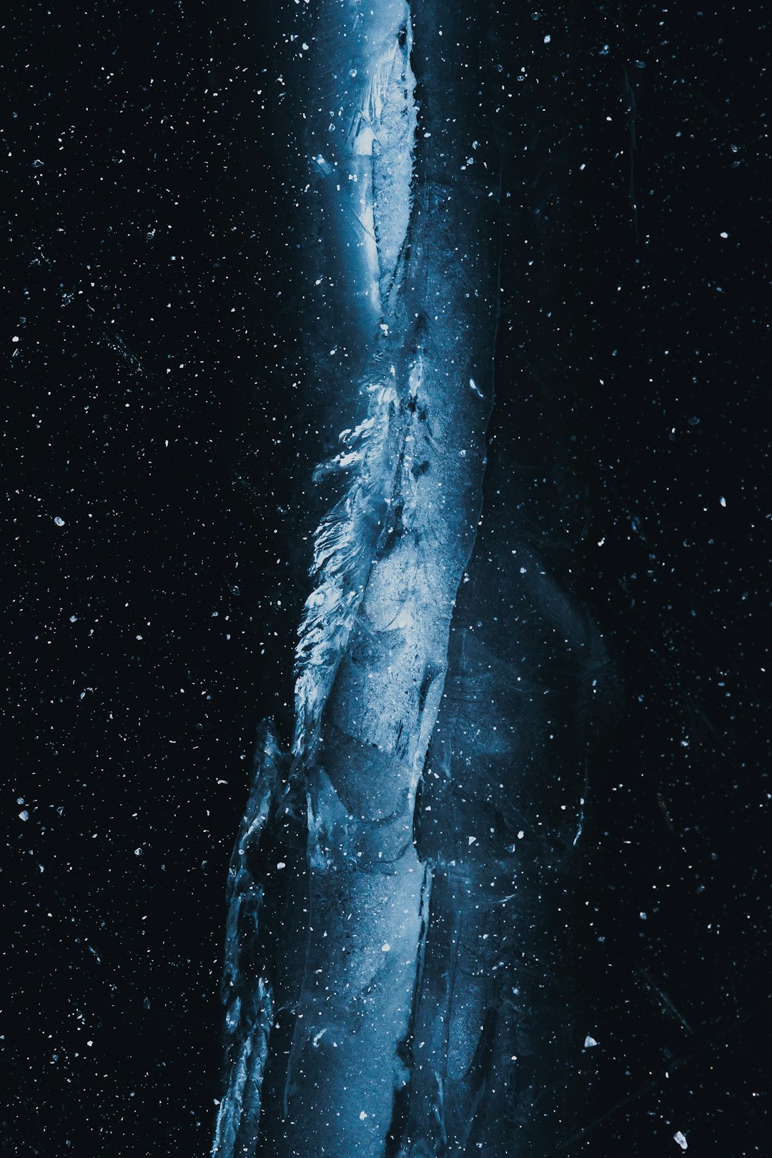 A large iceberg in the middle of the night