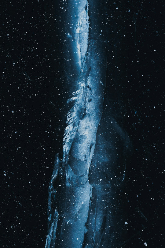 A large iceberg in the middle of the night