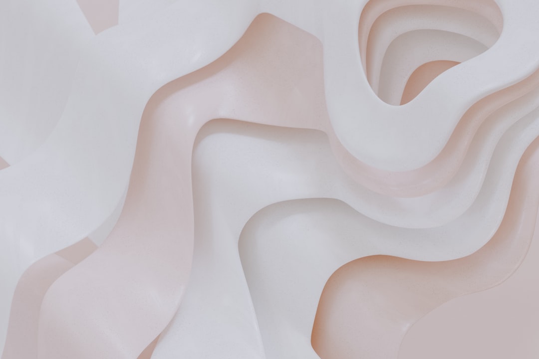 A close up of a white and pink wall